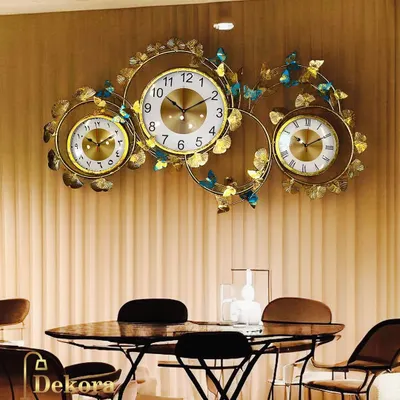 The Big 3 Countries Time wall decor art, shown in a dining room setting, serves as both a functional timepiece and a magnificent piece of wall sculpture.