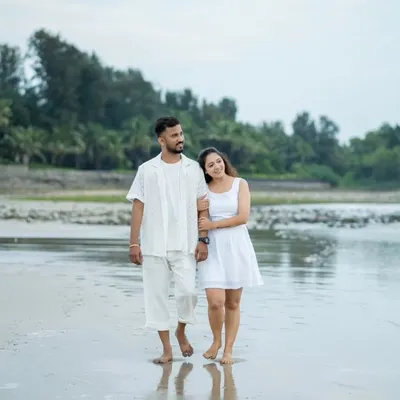 A quiet walk on the beach, just the two of you. I love capturing these simple, serene moments during a pre-wedding shoot.