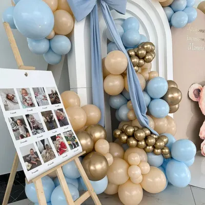 A beautiful way to share your baby's journey is with a first-year photo milestone board. I place this on an easel and integrate it into the main decor, as seen in this teddy bear themed party.