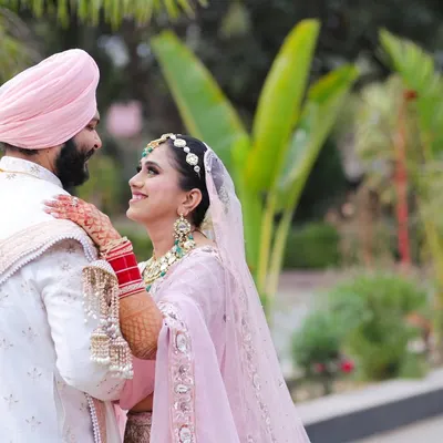 A beautiful candid moment between a Sikh bride and groom. The way she looks at him and his gentle smile create a portrait filled with love and warmth.