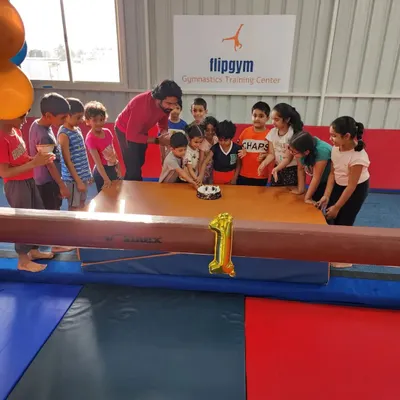 We love celebrating milestones together. Here is the whole crew gathered to cut the cake for Flipgym's first anniversary.