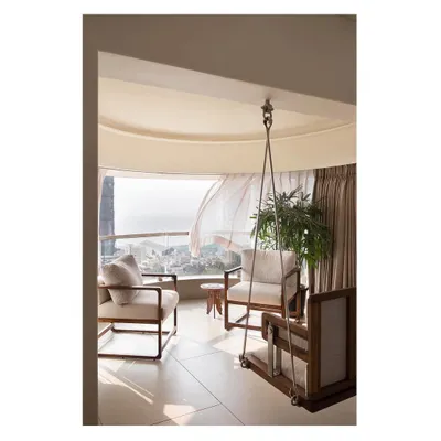 The highlight of this Mumbai apartment is the bay window seating area, complete with a custom swing. It’s a perfect example of how we create spaces that connect with the outdoors and provide moments of peace.