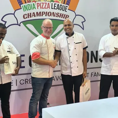 A proud moment for me, shaking hands with one of the judges after securing 2nd place at the All India Pizza Championship in Noida. It was an honor to compete with talented pizza makers from all over the country.