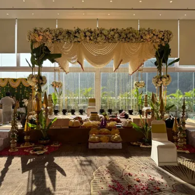 A classic South Indian wedding mandap, bathed in natural morning light. We used traditional elements like banana leaf pillars and garlands of white tuberoses to create a serene and sacred space for the ceremony.
