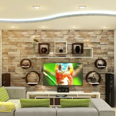 A living room centered around a custom entertainment unit set against a stone-cladding accent wall. The design includes a variety of circular and rectangular floating shelves for a unique display.