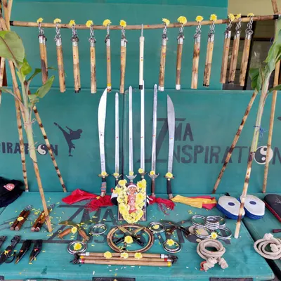 A display of our training tools during the Ayudha Pooja. Each weapon, from the nunchucks and broadswords to the rope darts and Bo staffs, has its own spirit and discipline.