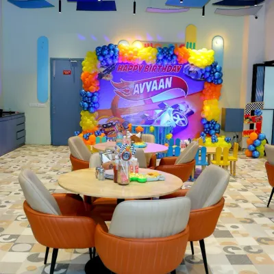 A 'Hot Wheels' themed birthday party in full swing! We transformed our cafe area with custom banners, balloon arrangements, and table settings to create an immersive racing world for the birthday boy.
