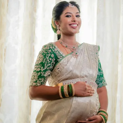 The beautiful Swathi glowing at her baby shower. I created a fresh, traditional look with a focus on radiant skin to celebrate this special milestone.