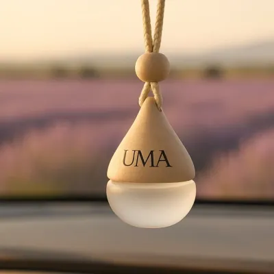 My car freshener hanging in front of a calming lavender field. I offer these in five soothing fragrances, including Lavender and Sandalwood, to turn every ride into a scented escape.