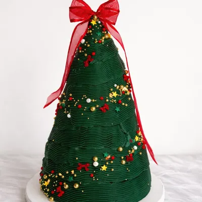 If Christmas came in cake form, this would be it. This Christmas tree-shaped cake was pure joy to create. It reminds me why I started baking in the first place.