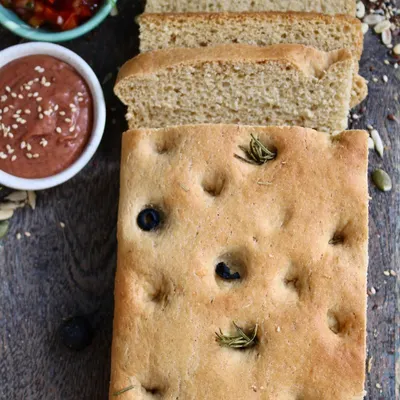 Our freshly baked olive and rosemary focaccia bread. It's made with whole wheat and is perfect for dipping or as a side to your meal. The aroma alone is enough to make you happy.