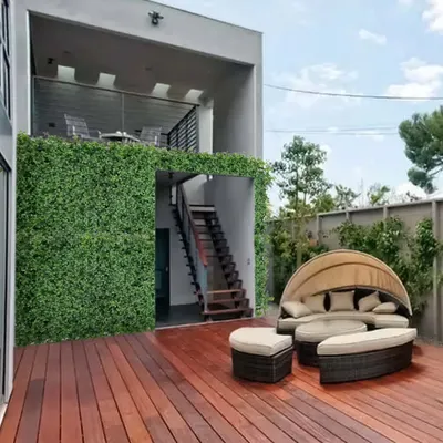 Imagine relaxing here. I turned this outdoor terrace into a private green oasis by covering the walls with a lush, maintenance free artificial garden, creating the perfect spot to unwind.