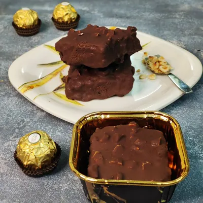 My Ferrero Rocher brownie is the definition of indulgence. It's a rich chocolate brownie coated in a layer of chocolate and toasted hazelnuts, capturing the iconic flavor in every bite.