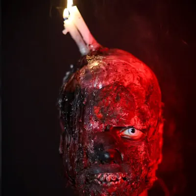 This chillingly realistic burn makeup with a melting candle is a masterclass in SFX artistry. Our students learn to use prosthetics and special materials to create horrifyingly beautiful effects.