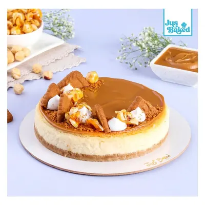 A full view of my Biscoff Baked Cheesecake, one of our bestsellers. The top is covered in smooth Biscoff spread, crushed biscuits, and delicate meringue kisses for that perfect finish.