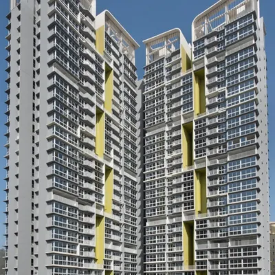A frontal view of the Serein towers, emphasizing the verticality and modularity of the design. The interplay of glass, concrete, and colored panels creates a visually interesting facade that is both modern and functional for residential living.