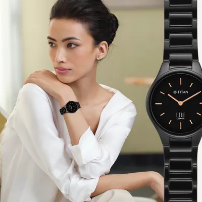 A campaign image for the Titan Edge ceramic watch. The styling is minimalist and sophisticated, pairing a simple white shirt with the sleek, all-black watch to emphasize its elegant design and modern appeal.
