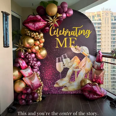 This one is for you. A "Celebrating ME" backdrop for a self-love or bachelorette party, featuring a glamorous design with champagne, heels, and sparkling details, framed by a rich burgundy and gold balloon garland.