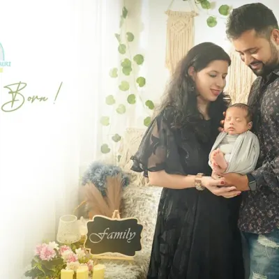 "A Star is Born." A beautiful moment as new parents gaze lovingly at their newborn. We create these light-filled, airy portraits that feel both classic and modern.