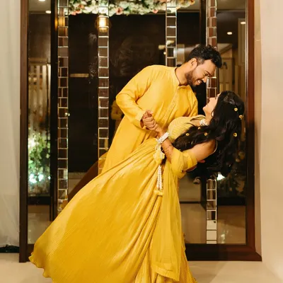 The playful side of the haldi ceremony. We captured Rasika and Vedant in a spontaneous dance, their yellow outfits a blur of happiness and motion.