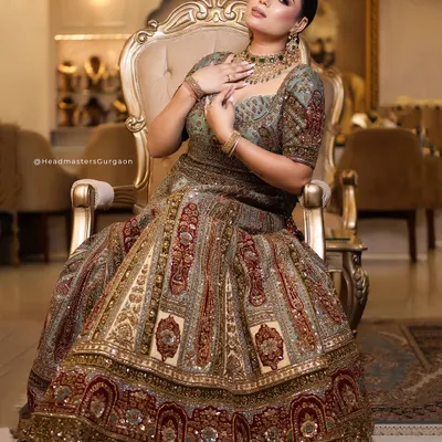 A regal bridal look featuring intricate jewellery and a rich, detailed lehenga. My makeup artistry focused on creating a radiant complexion and defined features to complement the grandeur of the entire ensemble.