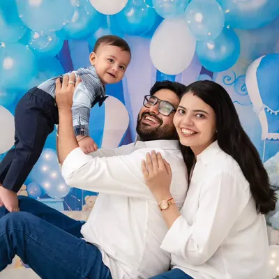 A moment of pure family fun. The father lifts his son, and everyone is sharing a genuine laugh. This is the kind of joyful, chaotic moment we love to capture.