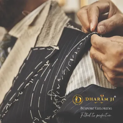 Bespoke tailoring is all about precision. Here, you can see the basting stitches on a suit jacket, a crucial step in hand-crafting a garment that is fitted to perfection for your body.