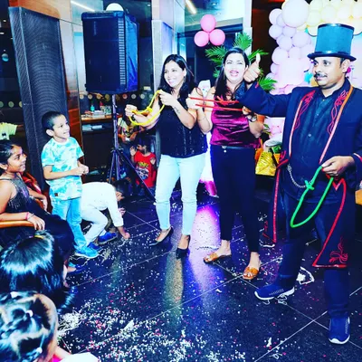 The moment of revelation during the linking rings trick. The surprised and happy faces of the volunteers are the best part of performing interactive, close-up magic at parties.
