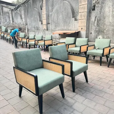 A large order of my boxy lounge chairs with black frames and cane panels, ready for a hotel lobby or cafe. I can produce furniture in large quantities for commercial projects, ensuring consistency and quality across every piece.