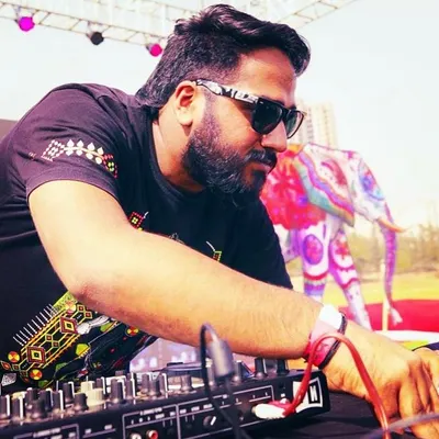 A candid shot of me DJing at a daytime event. Whether it's day or night, indoor or outdoor, the goal is always the same: make people dance.
