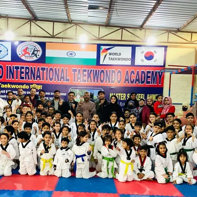 A group photo from one of our Belt Promotion Tests. It is a day of celebration where students, parents, and instructors come together to recognize the hard work and progress of our members.