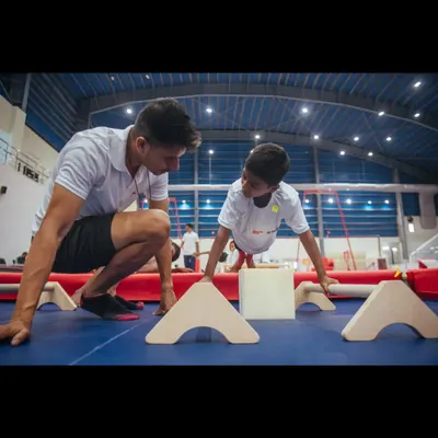 You truly do not become a 'coach' until you have coached younger athletes. Here, I'm working with a young gymnast, focusing on building foundational strength and instilling a professional mindset.
