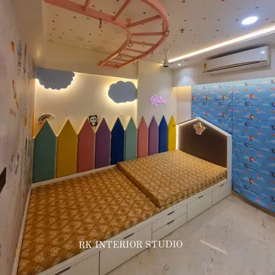 A child's room should be a place for imagination to grow. This kids' bedroom features a colorful pencil-themed headboard, custom beds with built-in storage drawers, and a playful, space-themed wall to create a fun and functional environment.