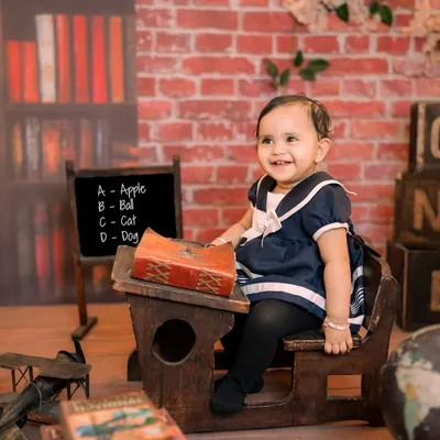 Back to school in the cutest way possible. Our rustic schoolhouse set features a miniature wooden desk, a chalkboard, and a globe, creating an adorable and scholarly scene for your little one.