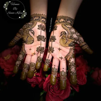 A stunning symmetrical design featuring the majestic peacock and the pure lotus flower, two of the most beloved motifs in traditional Indian mehndi.