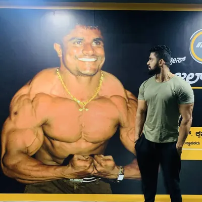 Looking up to my inspiration, my uncle Kitty Murthy, whose picture is on the wall of our gym. He is my god, and his guidance has shaped my entire career.