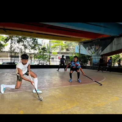 An action shot from our Sunday rink hockey session. The hard surface demands precise ball control and quick decision-making, skills that translate well to any format of the game.