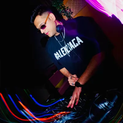Lost in the music, focused on the mix. This shot captures me in the zone, blending tracks and controlling the bassline to create a seamless journey.