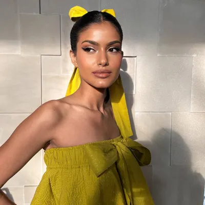 A sun-kissed and dreamy look for a fashion shoot. I created a sharp half-eyeliner and glowing skin, complemented by a playful yellow hair bow for a fresh, editorial feel.