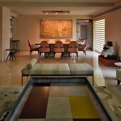 This 30-year-old home was once a collection of dark, inward-looking rooms. My design strategy was to break down the walls and open the space to the garden, creating a fluid, interconnected living area with a pale, serene palette.