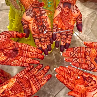 A beautiful group shot of several hands with their rich, stained mehandi, including a bridal portrait design. This shows my ability to cater to the entire bridal party.