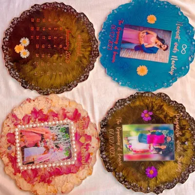 This image shows the wonderful variety you can choose from. Here are four different custom photo platters, each with a unique color scheme, from preserved rose petals to a bold blue ocean theme.