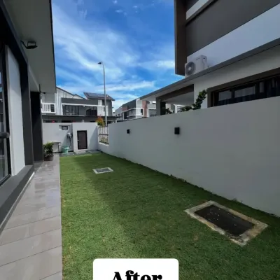 The beautiful 'After' view of a completed natural grass installation for a private residence. The result is a seamless, green carpet that completely revitalizes the home's outdoor area, providing a perfect space for relaxation and activity.