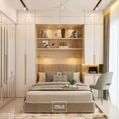 A masterclass in integrated bedroom design. The custom wardrobe, headboard, shelving, and study desk are all part of a single, beautifully crafted unit.