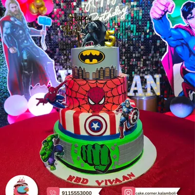 A four-tier superhero masterpiece for a big birthday bash. This cake features Batman, Spiderman, Captain America, and the Hulk, making it the ultimate treat for any young Marvel or DC fan.