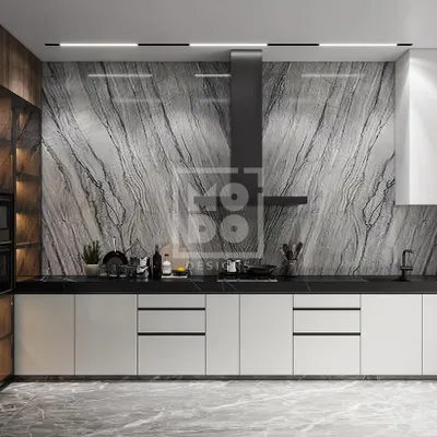 Cooking up a storm in style. This modern kitchen features a stunning marble backsplash, sleek white cabinetry, and a professional-grade chimney, blending high functionality with luxurious aesthetics.