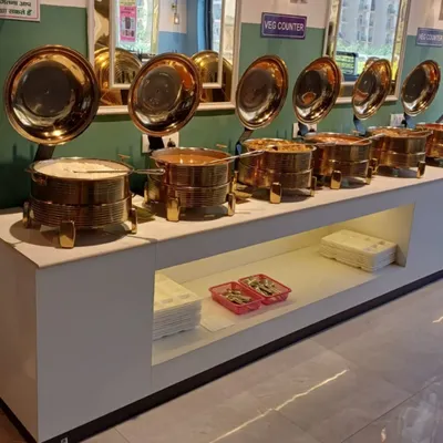 A close-up of my buffet counter. I use these traditional brass serving dishes, called 'chafing dishes', to keep the food warm and fresh for all my guests.