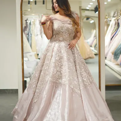 This is what fairytale dreams are made of. A stunning pastel ball gown with a voluminous skirt and delicate floral embroidery on the bodice. Perfect for a magical engagement or reception entrance.