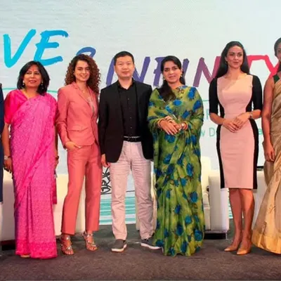 On stage at the 'Love & Infinity' Philanthropy Conference with fellow panelists. United, we can move forward and create meaningful change.
