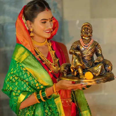 A powerful image from my 'Shivkanya' series, celebrating the legacy of Chhatrapati Shivaji Maharaj. The model is styled as a warrior princess, holding a statue of the great king.